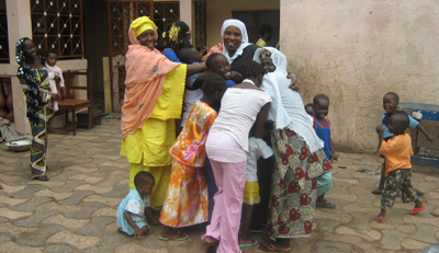 Sarata Jabbi-Dibba's family rejoices as she returns home. (The Point)