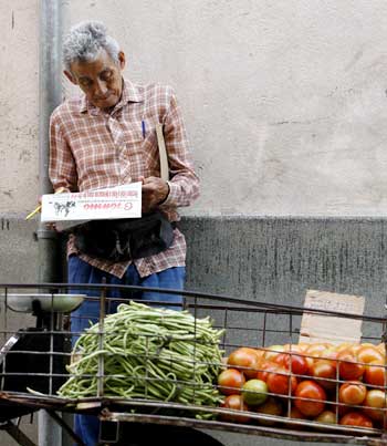 Journalistic blogs examine issues such as food shortages, health care, education, and housing. Above, a public market in Havana. (AP/Javier Galeano)