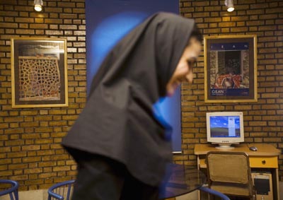 A woman at an Internet café west of Tehran. (Reuters)