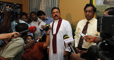 Mahinda Rajapaksa talks to reporters after being declared the victor in the country's presidential vote. (AP/Eranga Jayawardena)