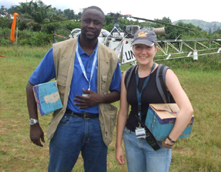 In this family photo, Didace Namujimbo is seen on assignment with an unidentified colleague.