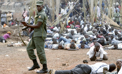 A Ugandan soldier quells a protest after fire destroyed the tombs of Bagandan kings. (Reuters)