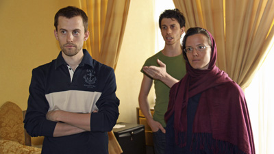 American hikers Shane Bauer, Josh Fattal, and Sarah Shourd wait to see their mothers at a hotel in Tehran, in May. (AP/Press TV)