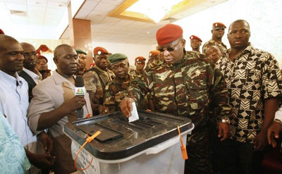 Transitional leader Sekouba Konaté casts his vote in June's historic elections in Guinea. (Reuters)