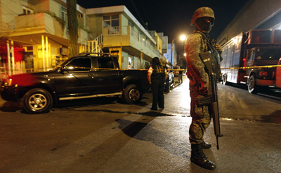 A soldier outside Televisa's Monterrey offices. (Reuters/Tomas Bravo)