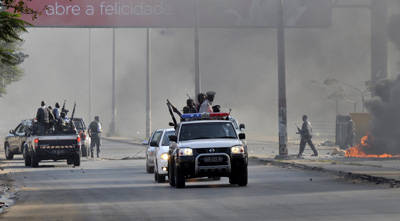 Police patrol the streets of the capital, Maputo. (Reuters/Grant Lee Neuenburg)