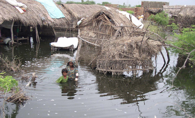 A mother and her daughter stand in flood waters in Badin district, northeast of Karachi (AP /Pervez Anjum)