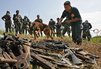 Police seized weapons from the Ampatuan clan but delayed turning them over to prosecutors. (AP/Pat Roque)