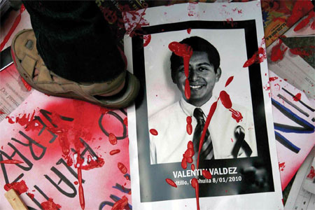 At a Mexico City protest against anti-press violence, a poster recalls the slain journalist Valentine Valdés Espinosa (AP/Marco Ugarte)