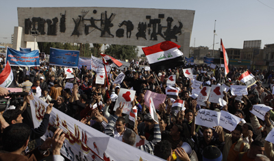 Military forces rounded up journalists in Baghdad's Tahrir Square, seen here today. (AP/Karim Kadim)