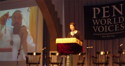 Zha Jianying discusses Ai Weiwei, pictured at left after a police attack, at the Pen World Voices Festival. (CPJ)