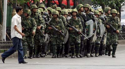 Chinese police patrol Urumqi following ethic violence in July 2009. (Reuters)
