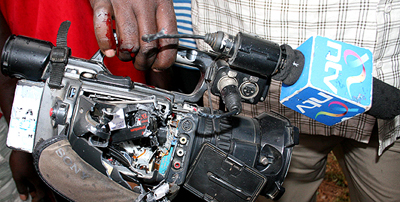 NTV cameraman James Ng'ang'a displays his camera, ruined by a bullet fired by a prison guard in Eldoret. (Nation)