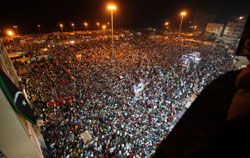 People gather near the courthouse in Benghazi on August 22. (Reuters)