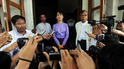 Opposition leader Aung San Suu Kyi speaks with reporters after a September meeting with the European Commissioner for International Cooperation. (AFP/Soe Than Win)