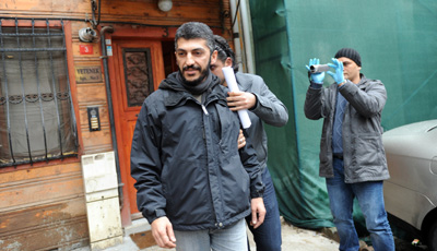 AFP photographer Mustafa Ozer is detained at his home in Istanbul. (AFP/Bulent Kilic)