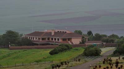 Reuters and The Associated Press are being investigated by authorities in South Africa for installing cameras pointed at Nelson Mandela's house, seen here. (AFP)