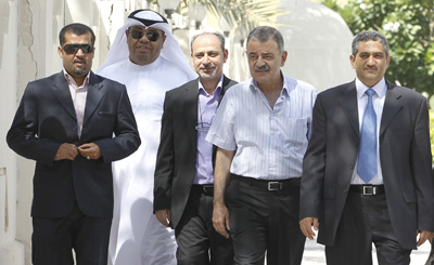 Journalists from Al-Wasat newspaper leave a Bahraini court after being fined US$2,650 each for publishing false news. (Reuters/Hamad I Mohammed)