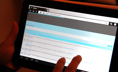 An Internet user checks a Twitter account in Saudi Arabia, where a journalist faces legal action after writing about the Prophet Mohammed on Twitter. (AFP/Fayed Nureldine)
