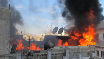 Journalists and other citizens are not being allowed to evacuate from the city of Homs, which has been repeatedly attacked by government forces. (AFP/LCC SYRIA)