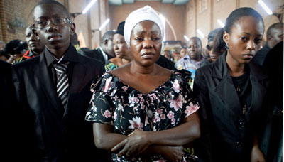 Chebeya's wife and two children at his funeral. (AFP)