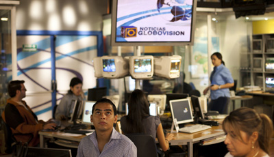 Journalists at work in Globovisión's main studio. Reporters from the station were attacked and threatened at a rally on Sunday. (Reuters/Carlos Garcia Rawlins)