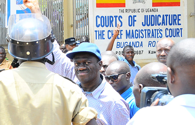 Three Ugandan journalists were beaten and detained by police on Wednesday while covering the release of opposition leader Kizza Besigye, seen here outside the court. (AFP/Isaac Kasamani)