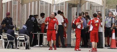 Police check journalist IDs outside the Formula One races on Sunday. Authorities have restricted and suppressed journalists in the run-up to the races. (AP/Hassan Ammar)
