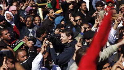 After photographer Tim Hetherington, seen here in Libya, died in April 2011, friend Sebastian Junger started an organization to train freelancers in battlefield first aid. (Reuters/Finbarr O'Reilly)