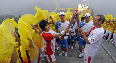 A journalist was charged with anti-government propaganda after he reported on protests against the 2008 Beijing Olympic torch relay, above. (AFP/Olivier Morin)