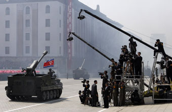 A North Korean tank moves past local journalists during an April military parade in Pyongyang. (AP/Ng Han Guan)