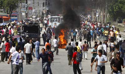 Protesters set fire to a motorcycle during the three-day strike in Nepal. (Reuters/Navesh Chitrakar)