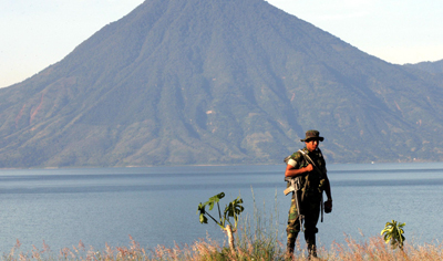 A soldier patrols a lake in the town of Panajachel, where journalist Lucía Escobar used to live. (AFP/Orlando Sierra)