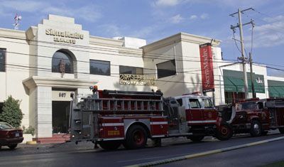 Fire trucks park outside Sierra Madre. (Reuters/Daniel Becerril)