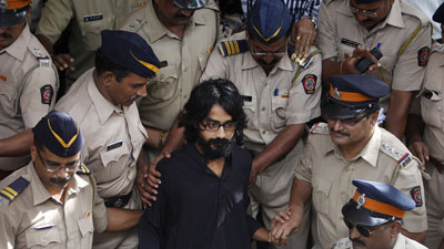 Cartoonist Aseem Trivedi, center, has been charged with sedition. (AP/Rafiq Maqbool)