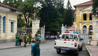 Police stand outside the entrance of the court where three bloggers were convicted and sentenced on anti-state charges today. (AFP)