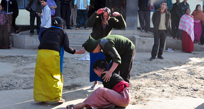 Family members mourn the death of an Indian journalist who was shot dead by police while covering a protest in Manipur on Sunday. (AFP)