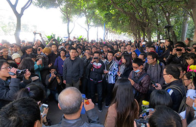 Demonstrators gather near the headquarters of Southern Weekly newspaper in Guangzhou, Guangdong province, on Monday. (Reuters/James Pomfret)