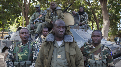 Soldiers with the Malian army speak to journalists. (Reuters/Joe Penney)