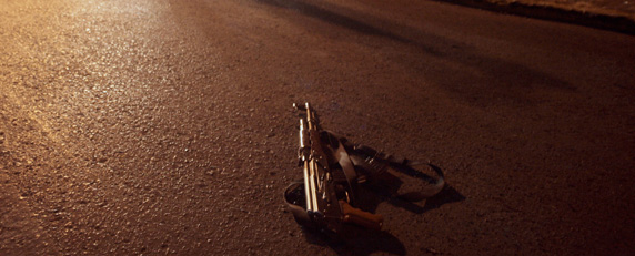A Kalashnikov lies on the street after a shootout between police and drug traffickers in Zacatecas. (AFP/Guillermo Moreno)