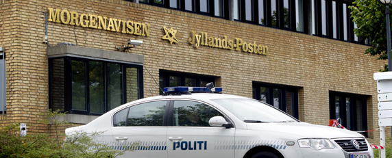 Police guard the offices of Danish newspaper Jyllands-Posten after the outlet was threatened for publishing a picture of Prophet Muhammad. (AFP/Brian Rasmussen)