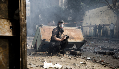 French photographer Rémi Ochlik, seen here in Cairo, was among those killed covering the war in Syria in 2012. (AP/Julien de Rosa)