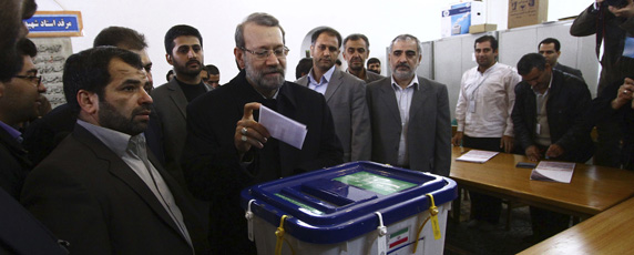 Potential presidential candidate Ali Larijani casts his vote in the parliamentary elections in March, 2012. (Reuters)