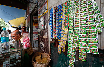 Dinesh Choudhary was attacked after reporting on illegal tobacco sales. Above, chewable tobacco is displayed at a roadside vendor near New Delhi. (AP/Saurabh Das)