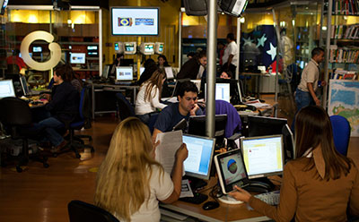 Globovisión's employees work at the station's main studio in Caracas. The broadcaster's owner has accepted a buyout offer. (Reuters/Carlos Garcia Rawlins)