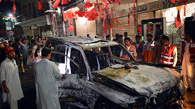 The site of a suicide bombing in Peshawar today, where more than 20 people, including at least one journalist, were killed. (AFP/A. Majeed)