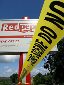 Yellow crime scene tape cordons off the offices of Red Pepper. (Patrick Mugumya)