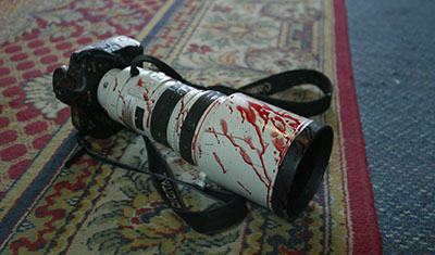 A blood-spattered camera in a Baghdad hotel. (AFP/Patrick Baz)