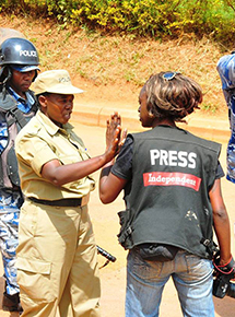 A journalist is obstructed from reporting on the protest outside the offices of the Monitor. (Facebook)