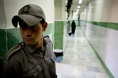 A prison official guards a corridor in Tehran's Evin Prison, where many journalists have been jailed over the years. (Reuters)
